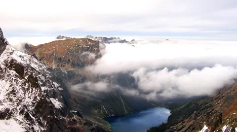 Clouds moving over the mountain lake timelapse in a high mountains landscape Stock Footage 39732066