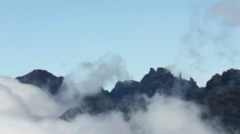 Clouds moving over mountain peaks Stock Footage 10578062