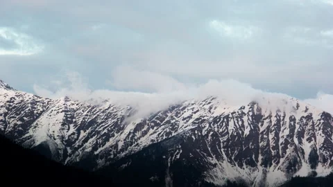 Clouds Moving Over Mountain Peaks Stock Footage 147576899