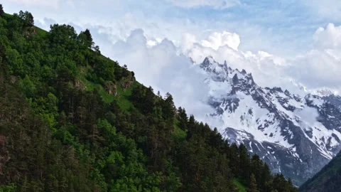 Clouds moving over mountain peaks timelapse Stock Footage 318867130