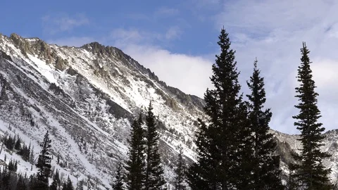 Clouds moving over mountain side Stock Footage 129712308