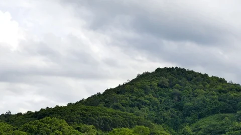Clouds moving over mountain time lapse Video stock 78217175
