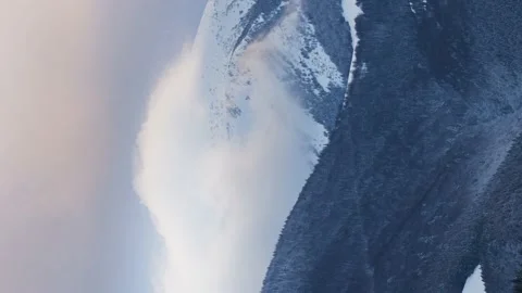 Clouds moving over the mountain in winter landscape. Vertical timelapse video Stock Footage 230922155