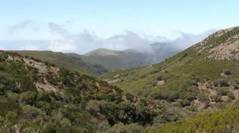 Clouds moving over mountains. Stock Footage 10578127