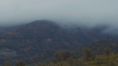 Clouds moving over mountains Stock Footage 88711535
