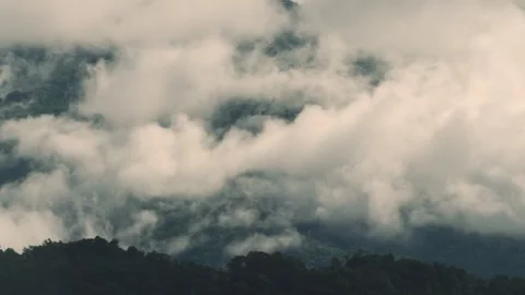 Clouds moving over the mountains Stock Footage 329541731