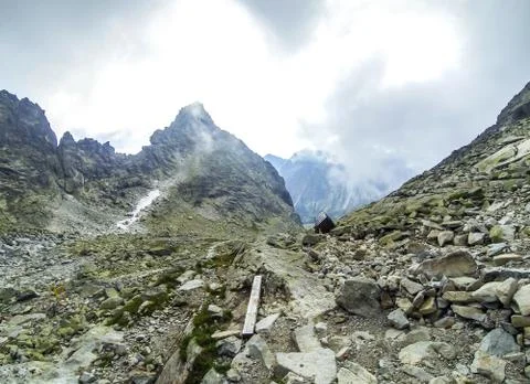 Clouds moving over the mountains Stock Photos