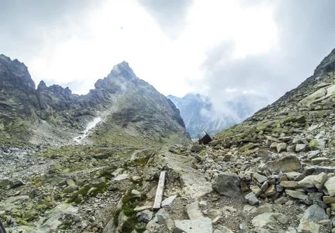 Clouds moving over the mountains Stock Photos