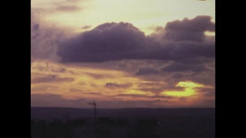 Clouds moving over paris at sunset in 1975 Stock Footage 291059557