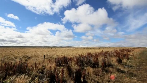 Clouds moving over patagonia plains Stock Footage 74073076