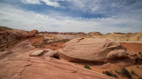 Clouds moving over red rocks formation Stock Footage 40707309