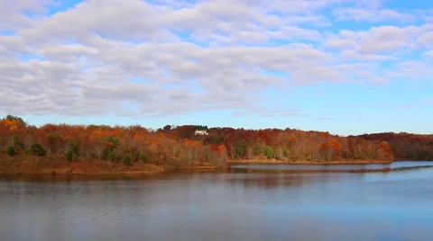 Clouds Moving Over River and Fall Trees Stock Footage 59636300