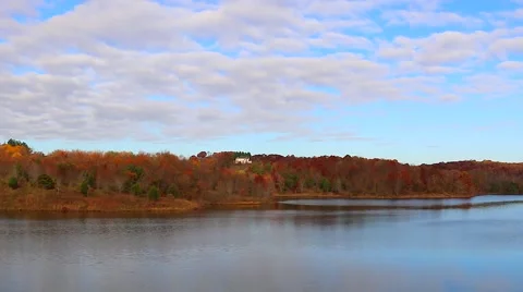 Clouds Moving Over River and Fall Trees Time Lapse Stock Footage 59636321