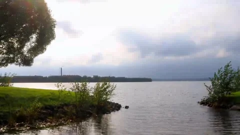 Clouds moving over the river by the coast Stock Footage 251433560