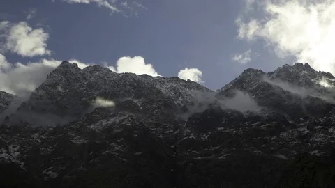 Clouds moving over rocky mountain peak 스톡 동영상 72500513