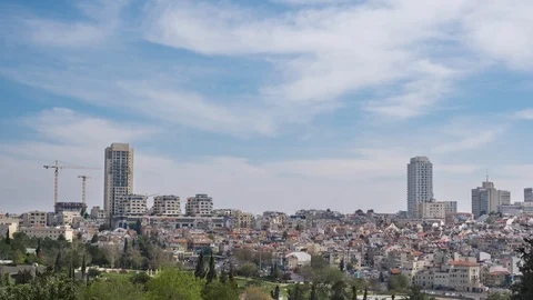 Clouds moving over the roofs of the old and modern Jerusalem. Panoramic view. 스톡 동영상 106780076