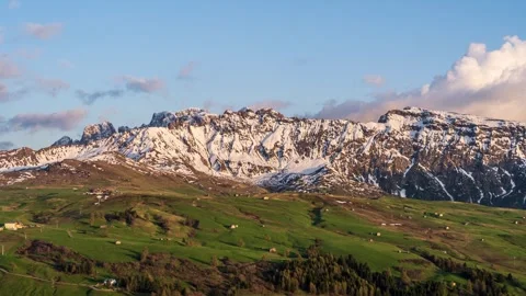 Clouds moving over rugged mountains and alpine meadows. Italian Alps (Timelapse) Stock Footage 244744809