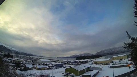Clouds moving over settlement during winter Stock Footage 83305563