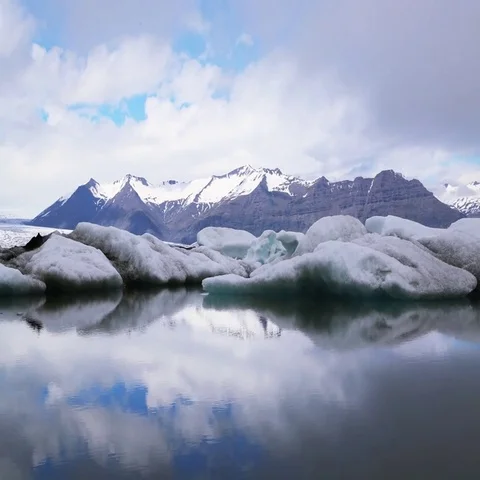 Clouds moving over snow covered mountain Stock Footage 69464338