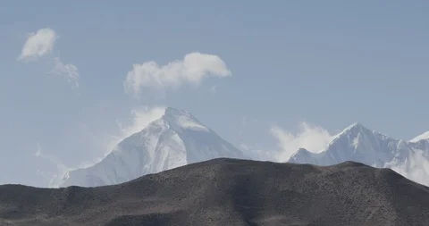Clouds moving over the snow covered Annapurna mountain ranges Video stock 145267966