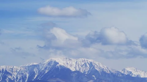 The clouds moving over the snow mountain landscape. Time Lapse. Stock Footage 50210956