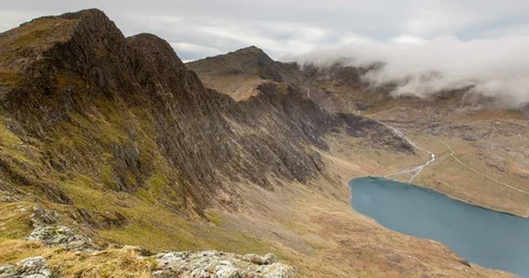 Clouds moving over the Snowdon mountain range in Snowdonia National Park, Wales Stock Footage 93901286