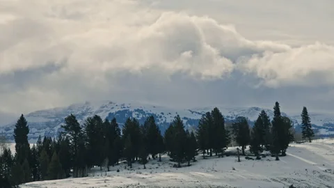 Clouds Moving Over Snowy Mountain Ridge in Winter Stock Footage 312867866