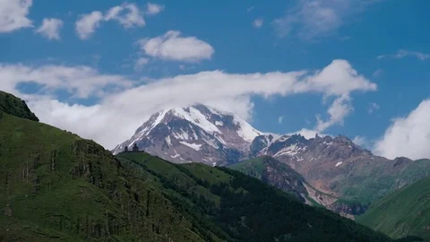 Clouds Moving over the tops of Georgian Mountains. Time lapse. Mount Kazbek Stock Footage 84239562