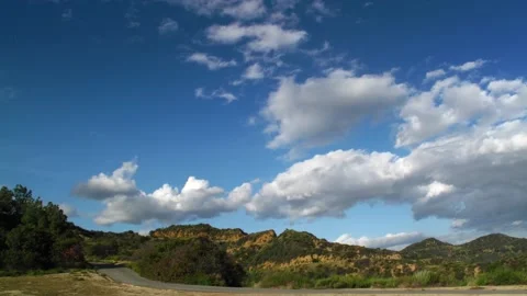 Clouds moving over trail in Hollywood Hills in Los Angeles California. Timelapse Stock Footage 281902370