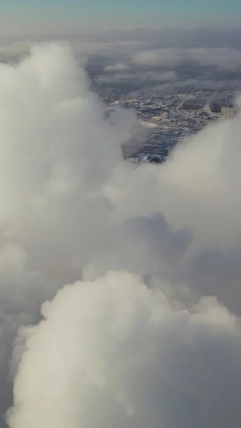 Clouds moving over winter city seen from above Stock Footage 307107090