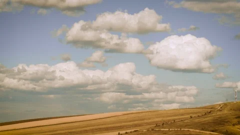 Clouds moving over yellow field - timelapse HD Stock Footage 119282830