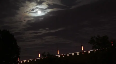 Clouds moving past a full moon in the night sky and Xi'an city wall,  China Stock Footage 37991500
