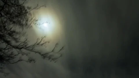 Clouds moving past the moon time-lapse Stock Footage 71378914