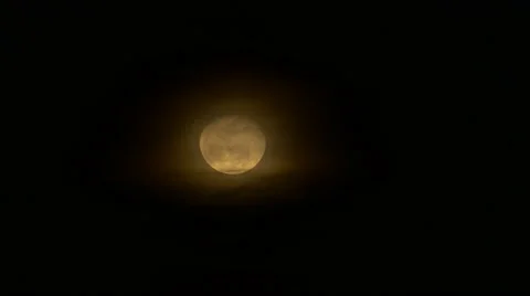 Clouds moving past spooky, yellow moon, 4K Stock Footage 59105913