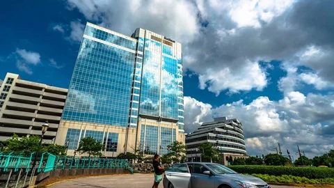 Clouds moving in reflection of building time lapse Stock Footage 91917473