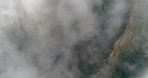 Clouds moving in sky about Kelimutu volcano crater aerial view, Indonesia Stock Footage 89415228