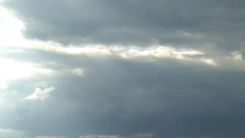 clouds moving in the sky, sun rays peeki... | Stock Video | Pond5