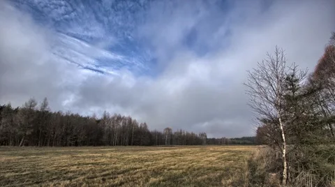  Clouds moving on the sky vely fast.  Meadow view in HDR. Stock-Footage 57318793