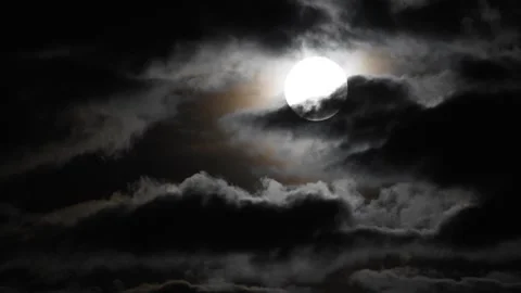 Clouds moving slowly in front of full moon Video stock 249015327