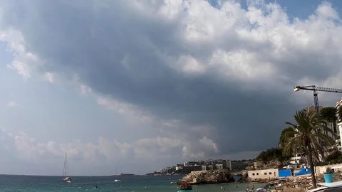 Clouds moving slowly in the sky time lapse over cala major mallorca Stock Footage 122360345