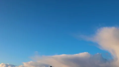 Clouds moving slowly in the sky time lapse Stock Footage 124093388