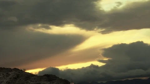 Clouds moving at sunset, dark clouds moving, storm arrives Video stock 82904427