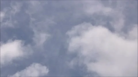 Clouds Moving Through Blue Sky Stock Footage 202094300