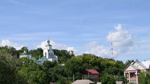 Clouds Moving Through The Sky Over Green Hills With Church Video stock 84119989