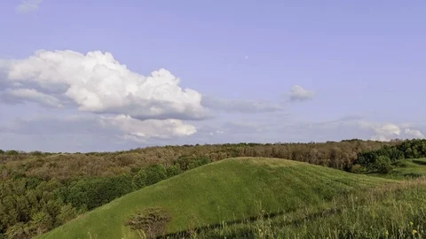 Clouds Moving Through The Sky Over Green Hills Video stock 84120675