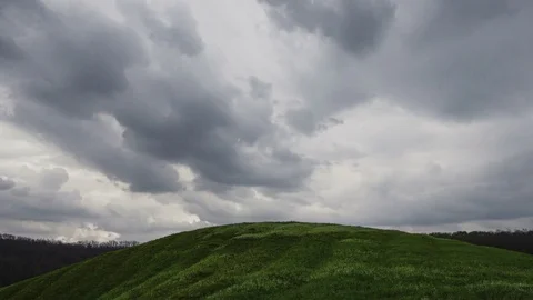Clouds Moving Through The Sunset Sky Over Green Field Video stock 84118228