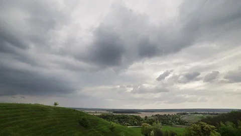 Clouds Moving Through The Sunset Sky Over Green Hills Video stock 84118340
