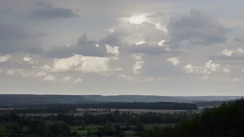 Clouds Moving Through The Sunset Sky Over Green Valley Video stock 84118978