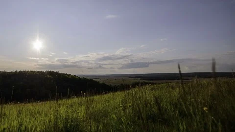 Clouds Moving Through The Sunset Sky Over Green Hills Video stock 84120378