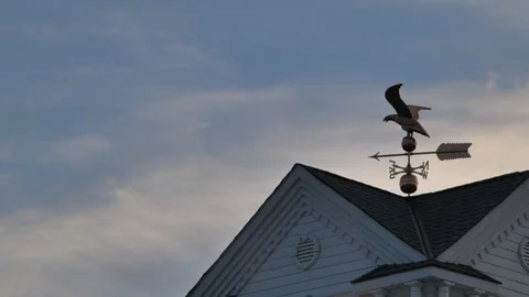 Clouds moving timelpase eagle weather vane Stock Footage 170384748